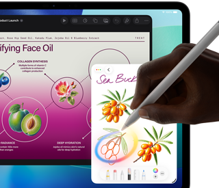 Vista frontal do iPad Pro, ecrã com fundo em gradiente azul escuro e verde com várias apps abertas, mão a segurar o Apple Pencil Pro a desenhar um círculo à volta de um esboço que mostra a funcionalidade Varinha gráfica da Apple Intelligence
