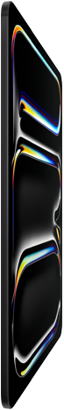 Vista frontal do iPad Pro, preto sideral, estrutura em alumínio e vidro, perfil fino, ecrã inclinado para trás a mostrar linhas multicoloridas
